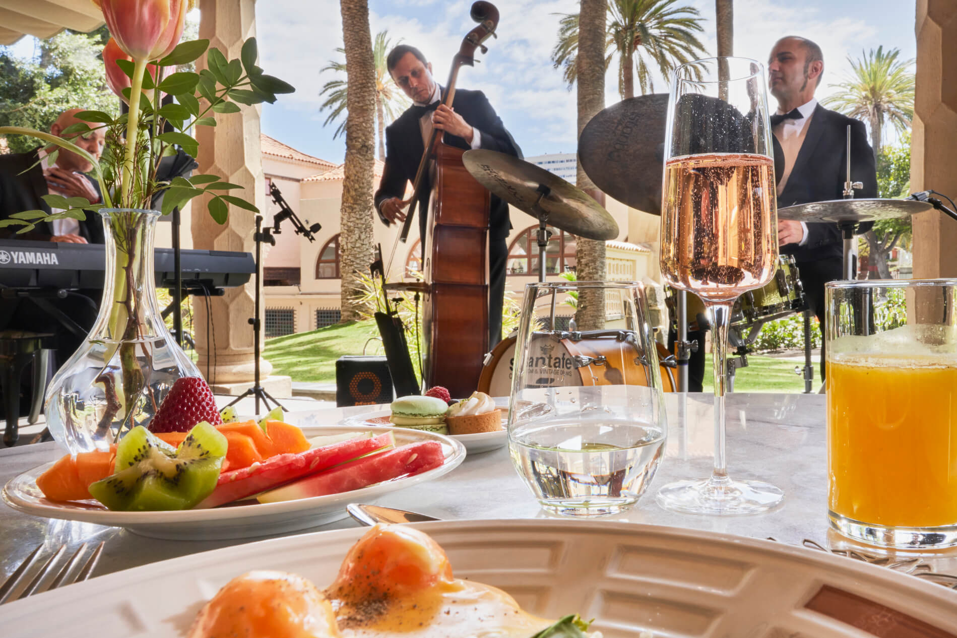 Jazz Brunch: A table laid for breakfast with musicians playing in the background