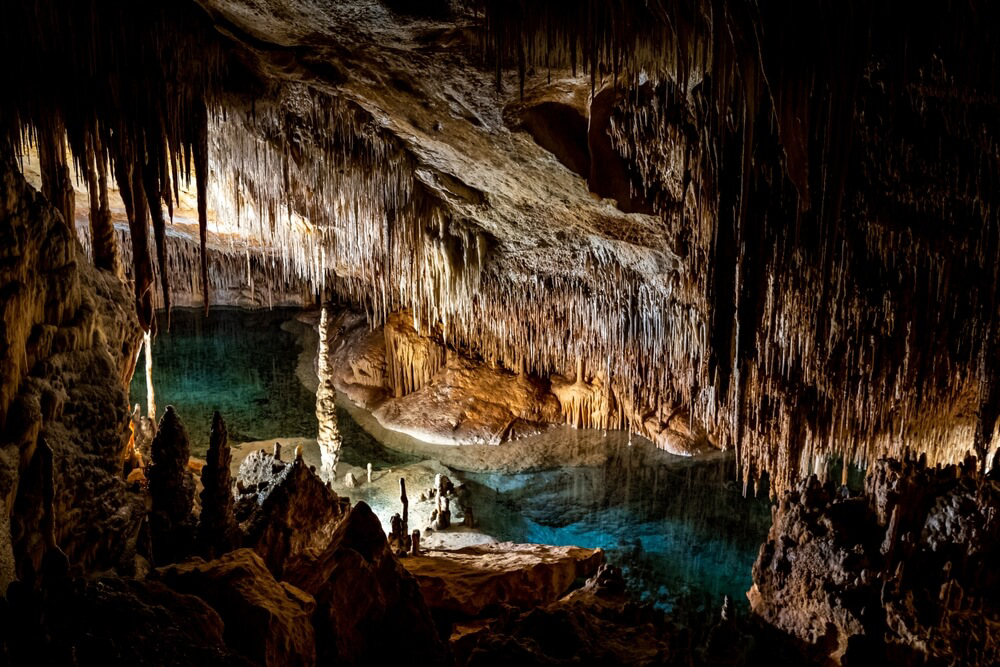 Drach Caves: Inside a dark cave with a lagoon