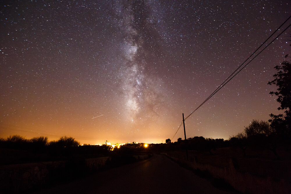 Stargazing: The night sky lit up with stars and red haze