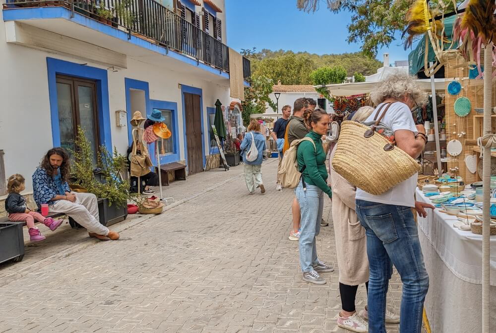 Markets in Ibiza: A typical street in Ibiza with a market and people shopping