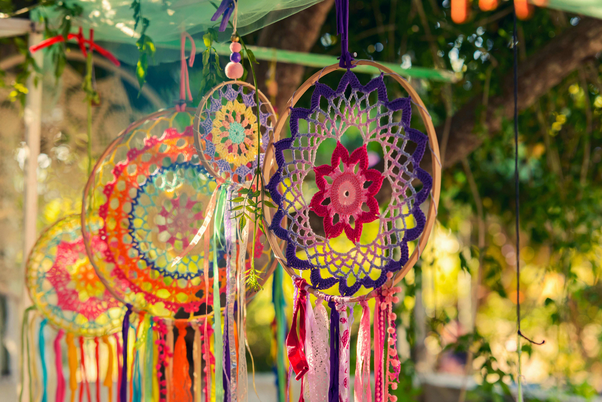 Markets in Ibiza: Multicoloured crochet dreamcatches hanging from the tree
