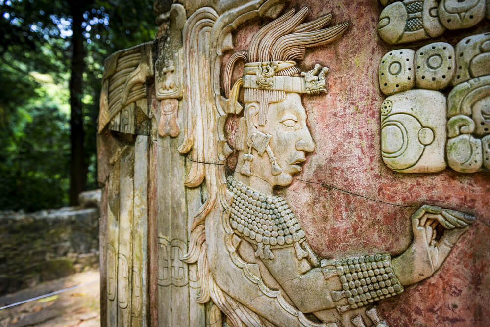 Mayan culture: Ornate stone wall with decorative figures