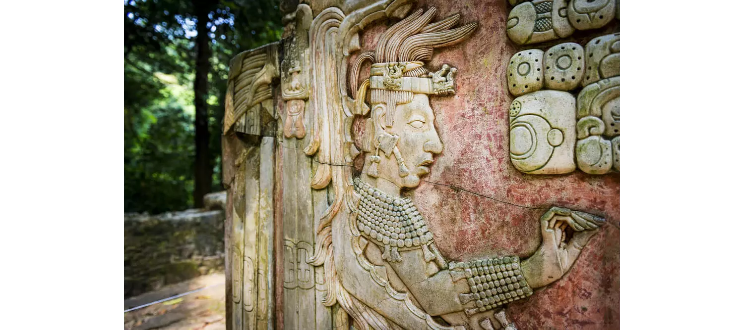 Mayan culture: Ornate stone wall with decorative figures