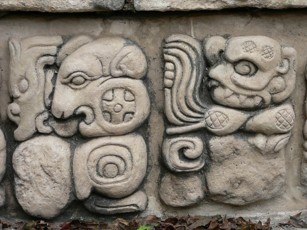 Mayan Culture: A close-up of a stone carved with Mayan symbols