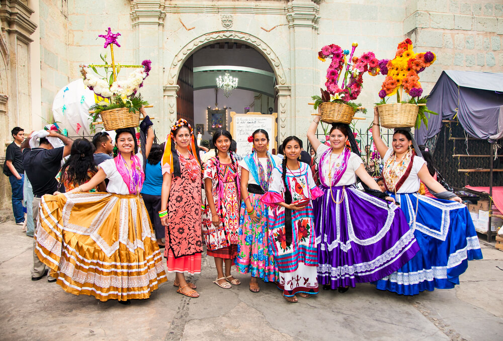 Mexican Christmas traditions: Women in traditional dress gathered in a public square