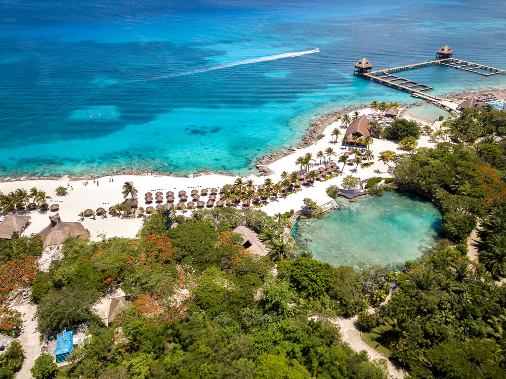 An aerial view of turquoise waters and white-sand beaches at Chankanaab park in Cozumel, Mexico.
