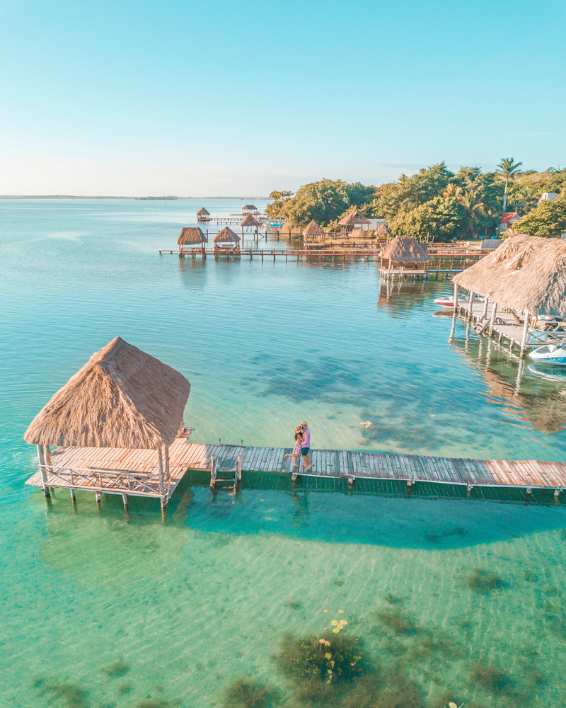 A couple kisses on a dock on Mexican Valentine's Day.