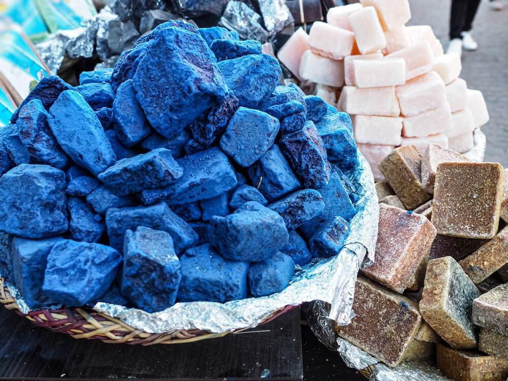 Nila Powder: A basket full of blocks of indigo compressed powder
