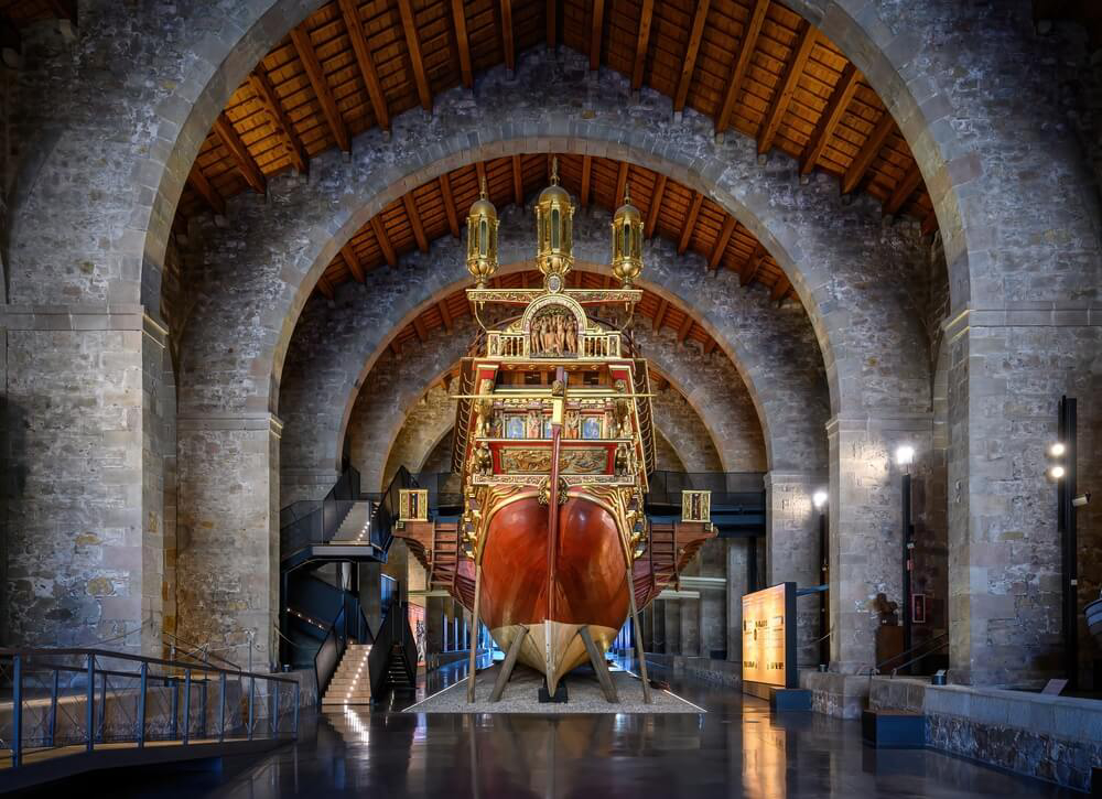 Maritime Museum of Barcelona: A close-up of the inside hall and a model of a ship