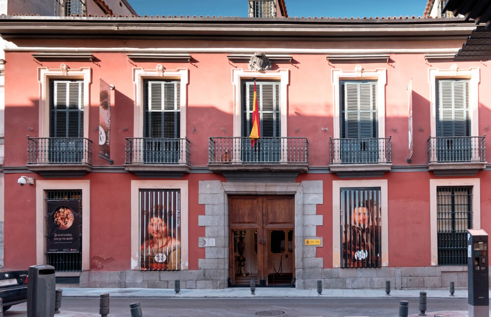 Museum of Romanticism: A red and stone colonial building with railings on the windows