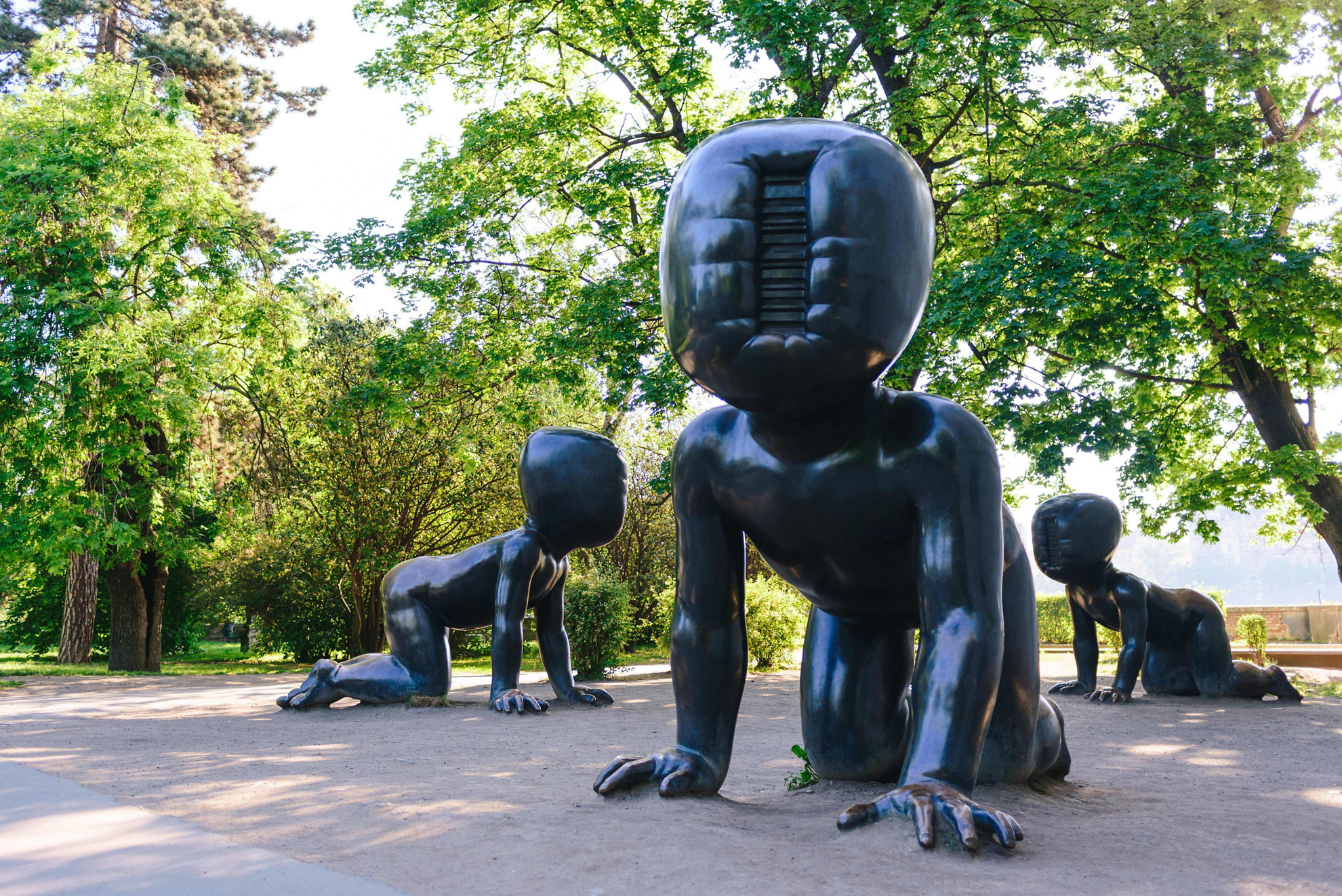 Museums in Prague: A collection of black modern statues in the form of bubble people