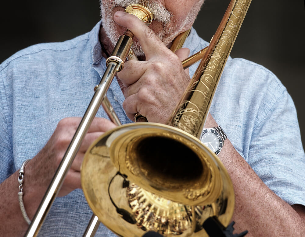 Music Festivals in Europe: Close-up of a man playing trombone