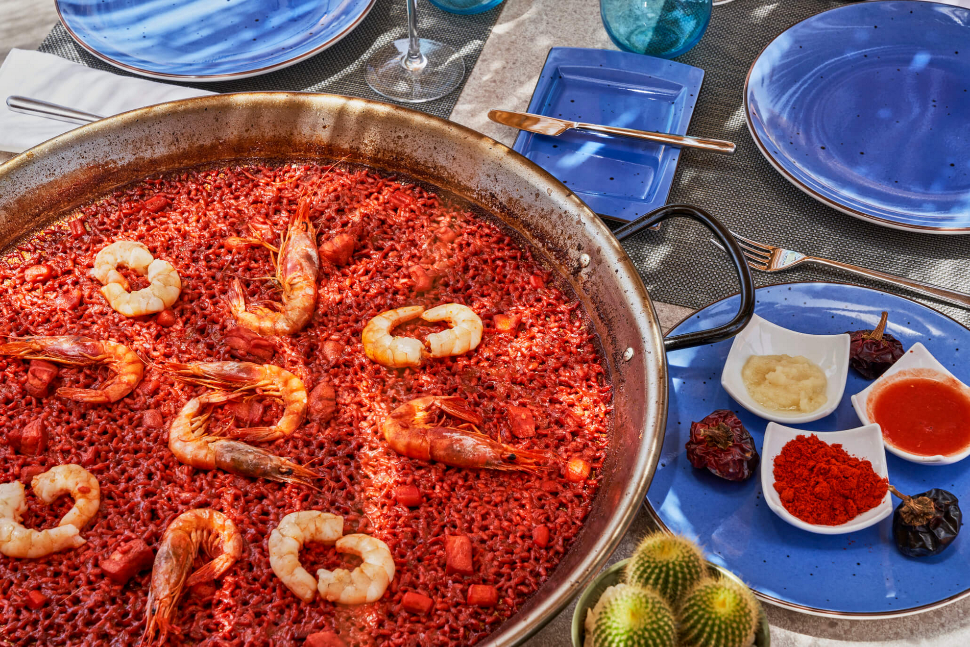 Arrozante: A red rice paella with prawns at Arrozante restaurant, Barceló Conil Playa