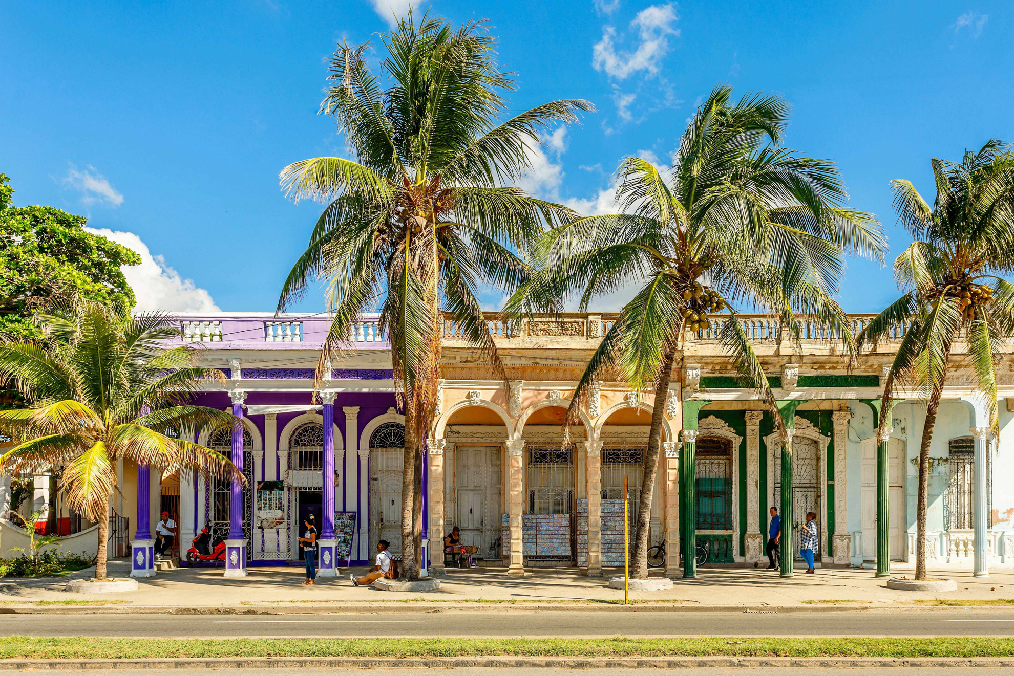 Places to visit in Cuba: A row of typical houses and buildings on a Cuban street