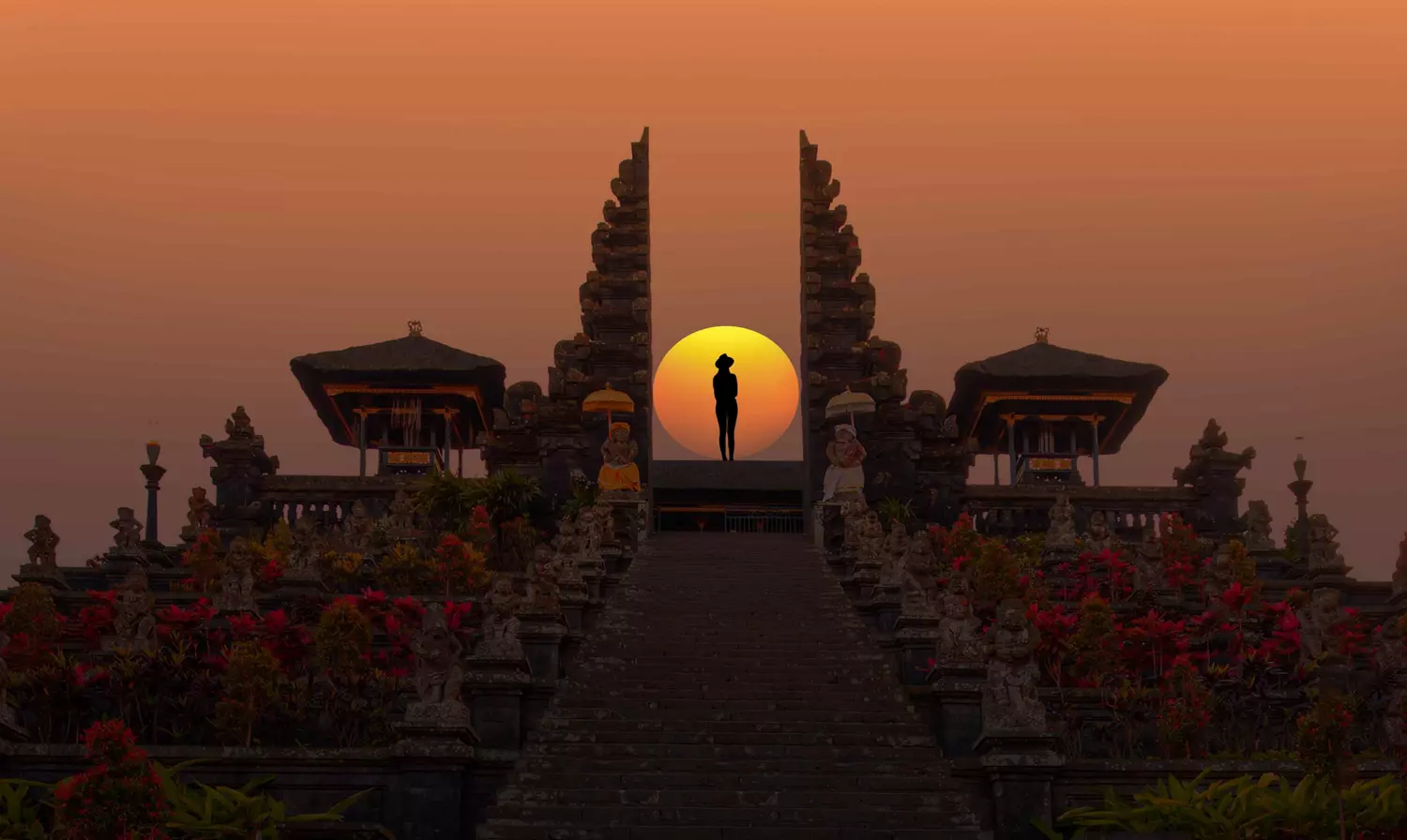 Places to visit in Indonesia: Sunset at a temple with a person standing in front of the sun