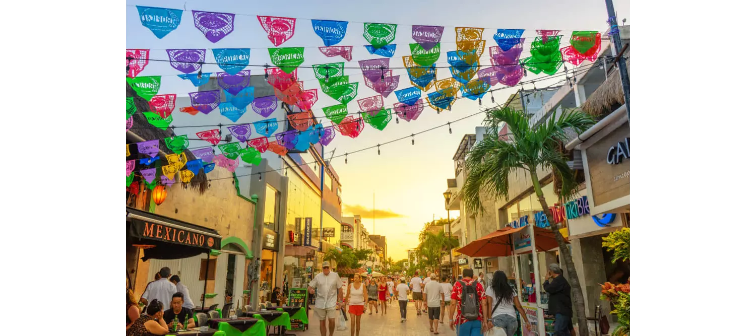 5th Avenue: People walking down the main shopping street in Playa del Carmen
