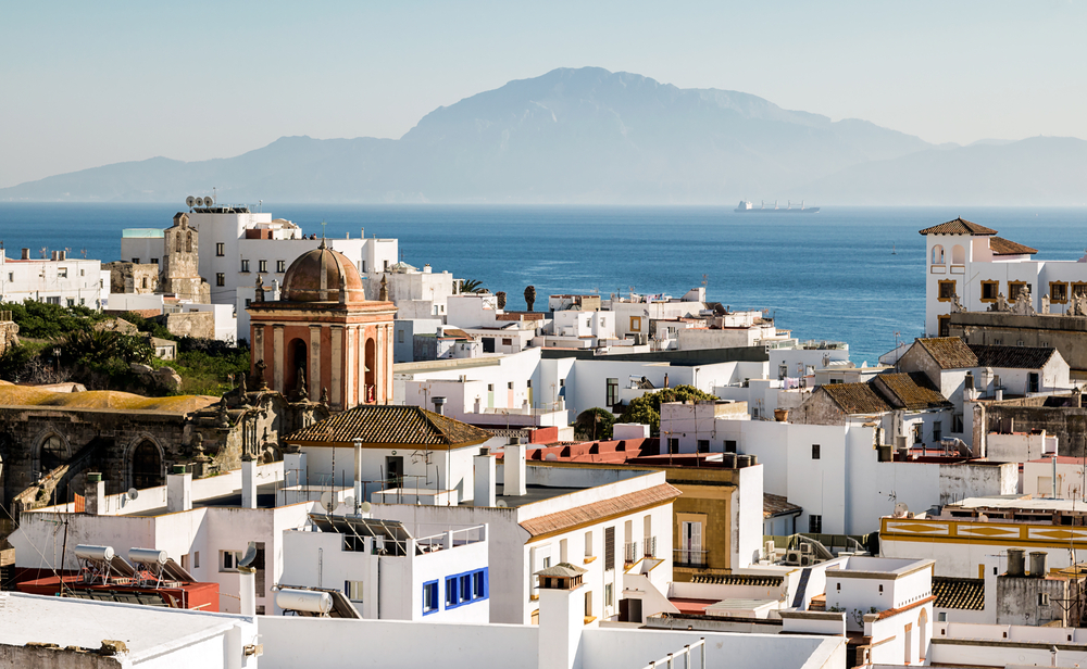 Tarifa: A view of the Tarifa skyline with Morocco in the distance overlooking the sea