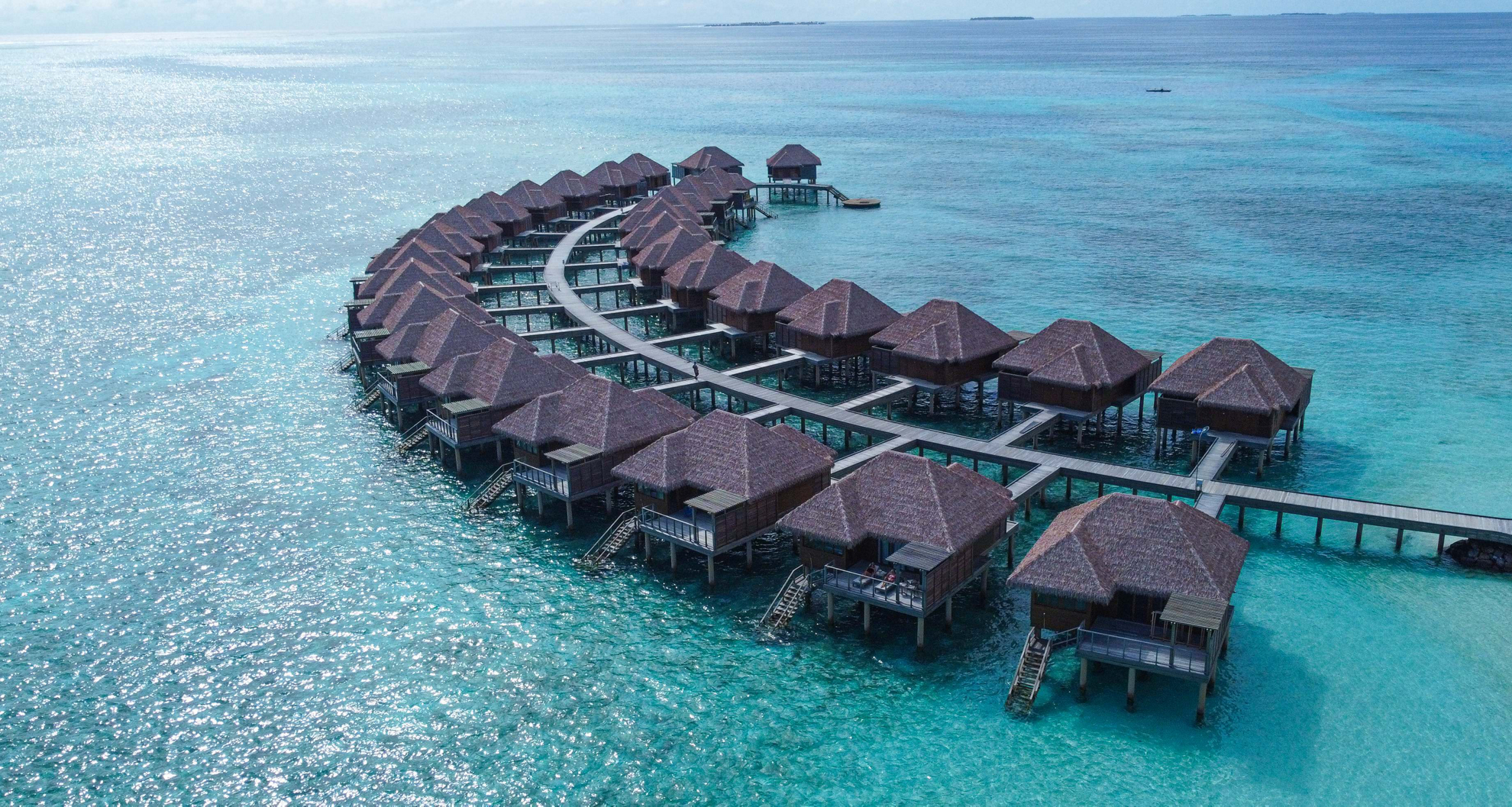 Regenerative tourism examples: A skyline view of the water villas at Barceló Whale Lagoon Maldives