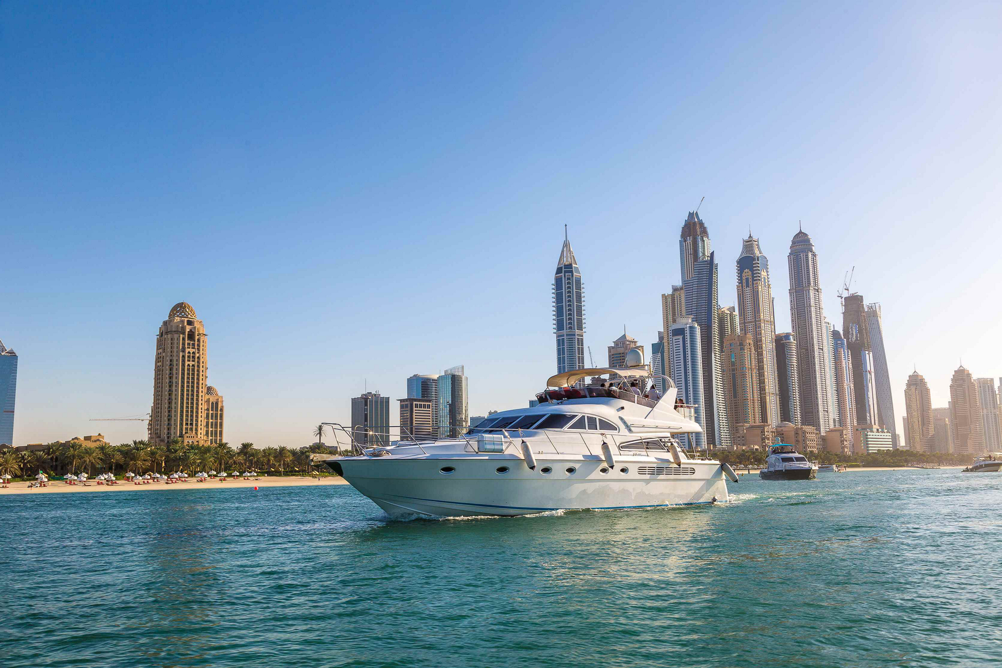 Yacht in front of the Dubai skyline