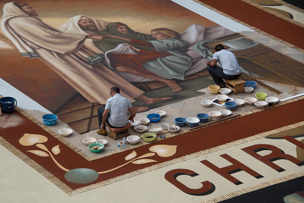The sand tapestries in La Orotava: Men creating sand paintings 