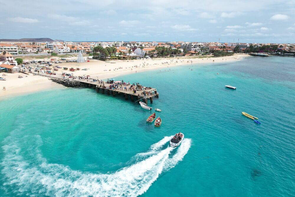 Palmeira Port: Topaz waters with a wooden jetty and fishing boats