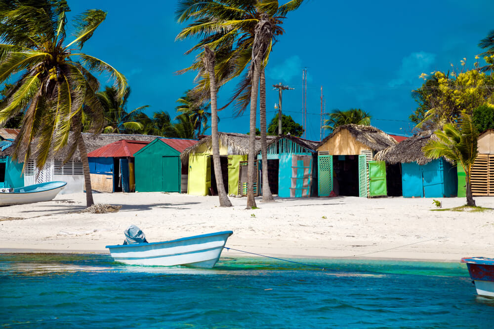 Pastel-colored homes dot the shores of Mano Juan, Saona Island.