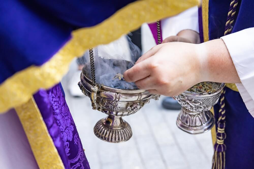 Incense: A silver burner being swung in church 