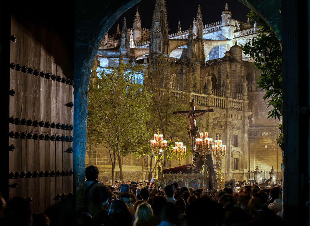 Seville: An Easter parade in the street in front of Seville Cathedral