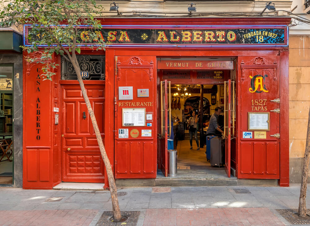 Madrid tapas bar: A red facade of a traditional tapas bar in Madrid, Spain