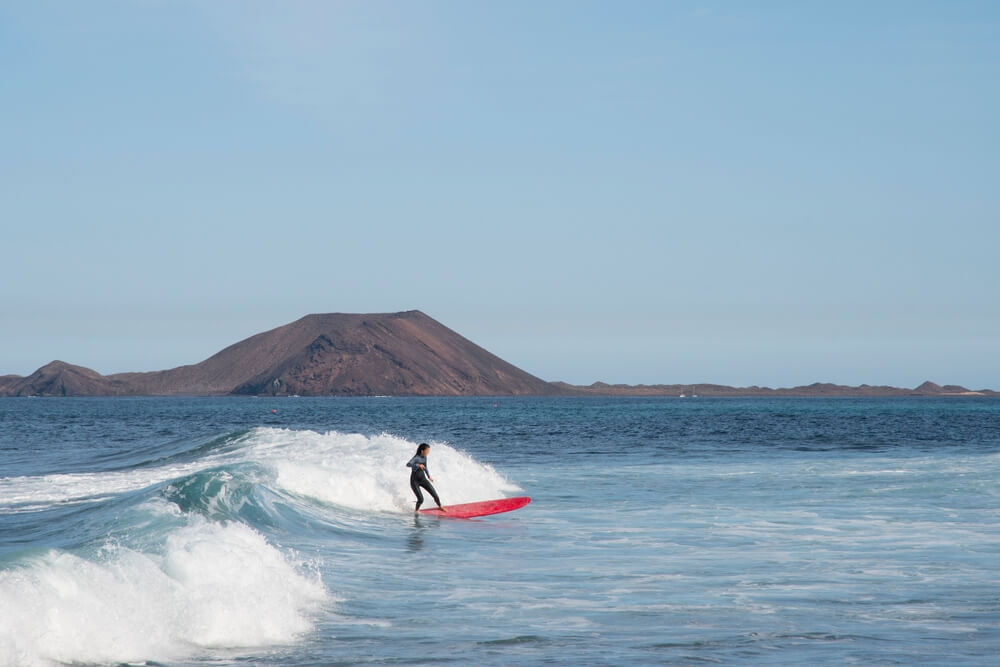Surf a point break in Corralejo on your trip to Fuerteventura.
