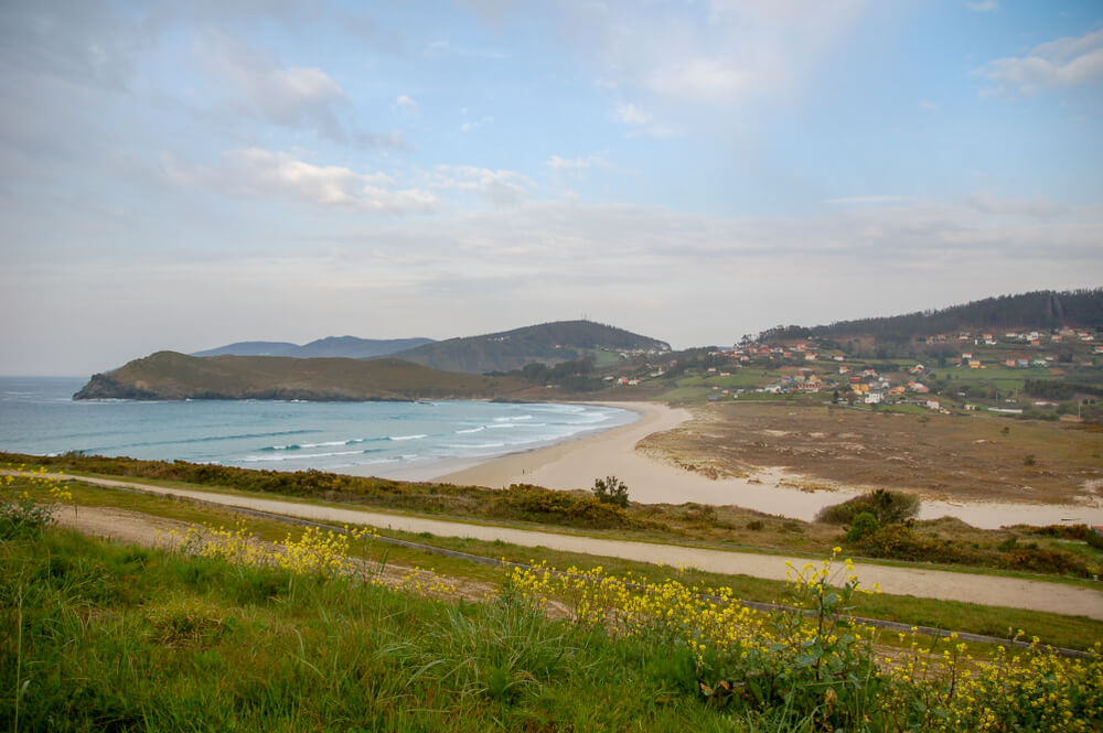 Pantín: A white inflatable arch in front of Pantín beach for the surf festival