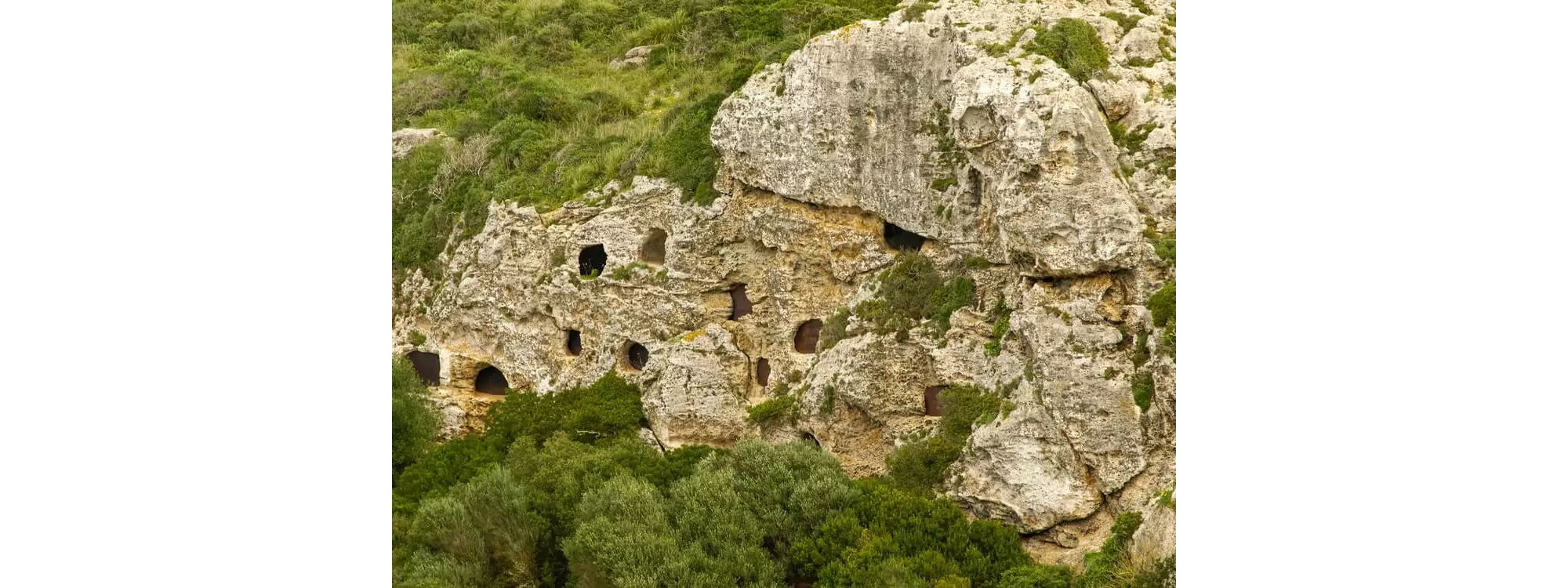 Calescoves Necropolis A close-up of the graves in the cliffs at Calescoves, Menorca