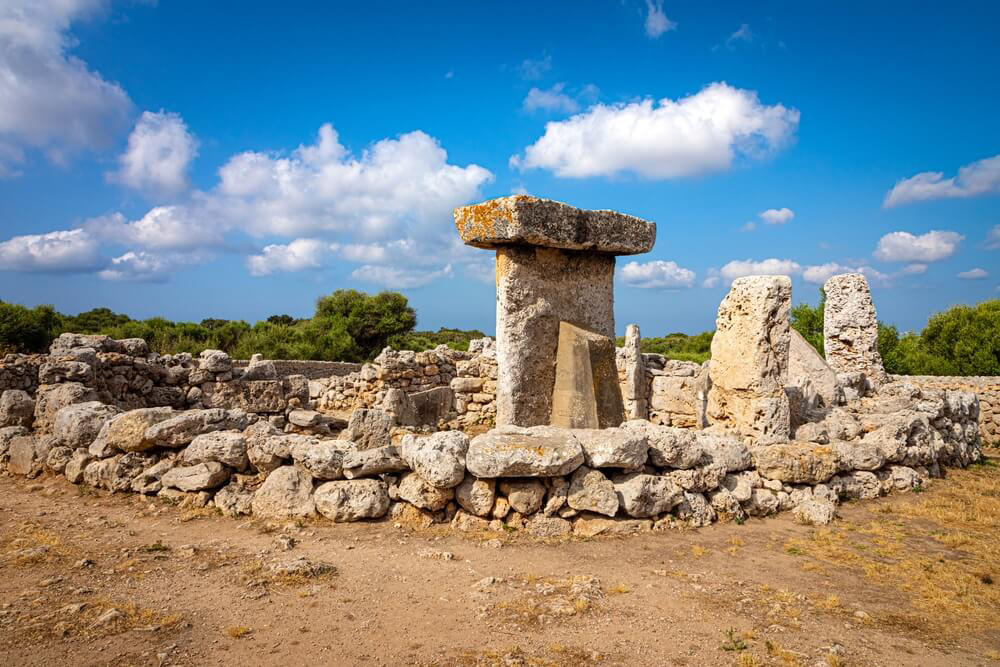 Talaiots Menorca: A group of large stones at an ancient ruin of a prehistoric megalith