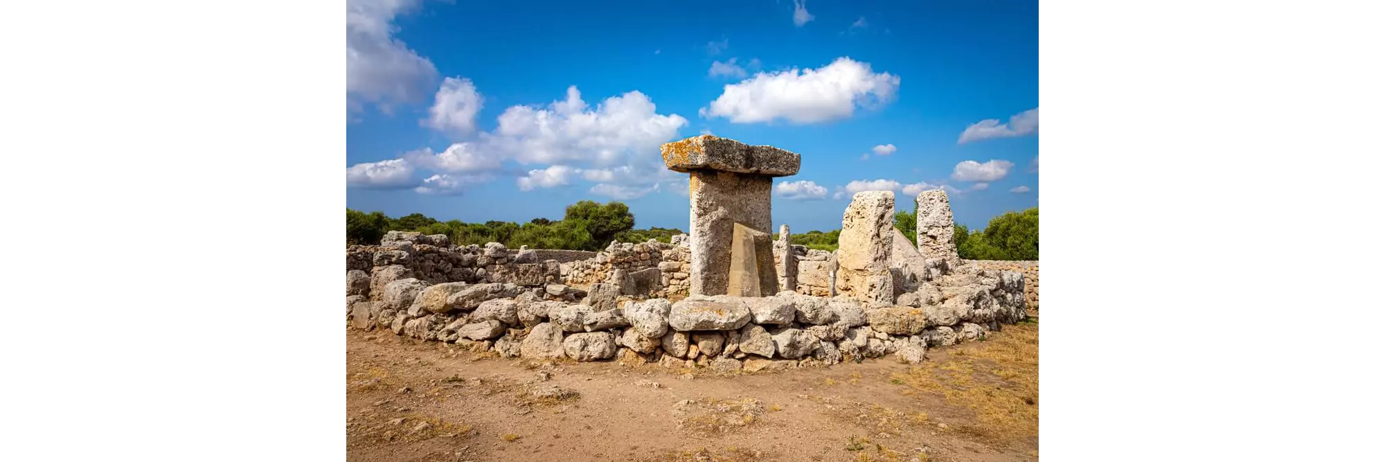 Talaiots Menorca: A group of large stones at an ancient ruin of a prehistoric megalith