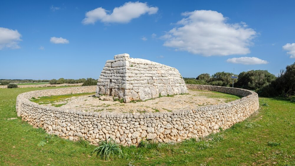 Talaiots Menorca: A close-up of the white rock megalith of Naveta des Tudons