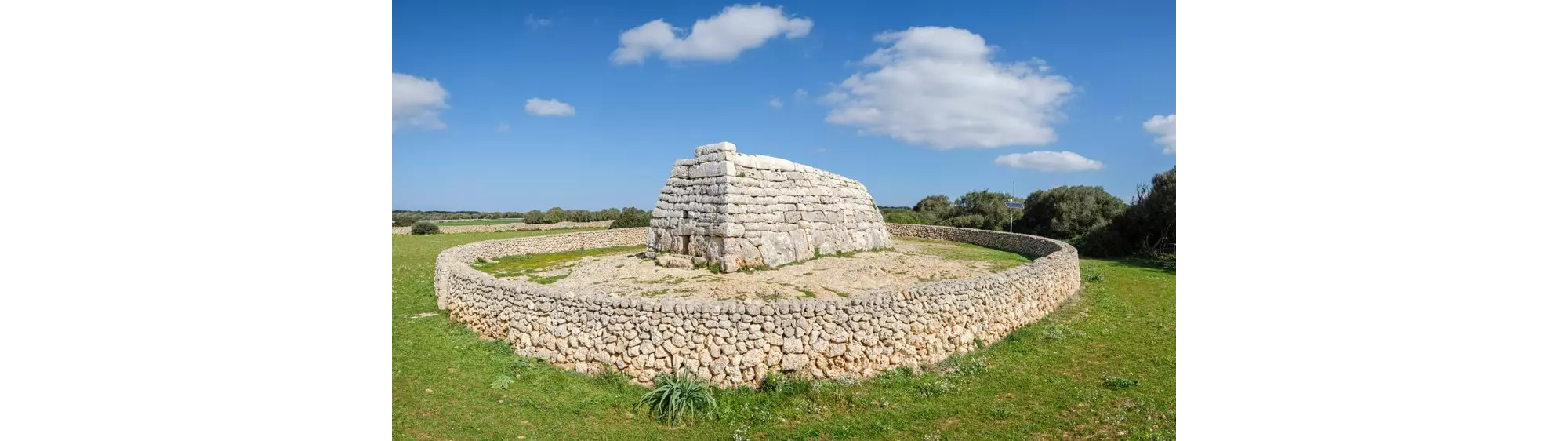 Talaiots Menorca: A close-up of the white rock megalith of Naveta des Tudons