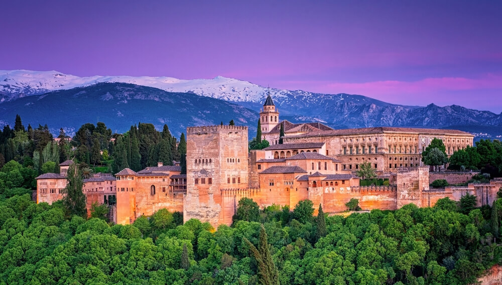 History of the Alhambra: A view of the Alhambra palace as sunset from a distance