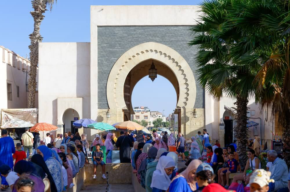 Souk El Had: An archway and market full of people in Agadir