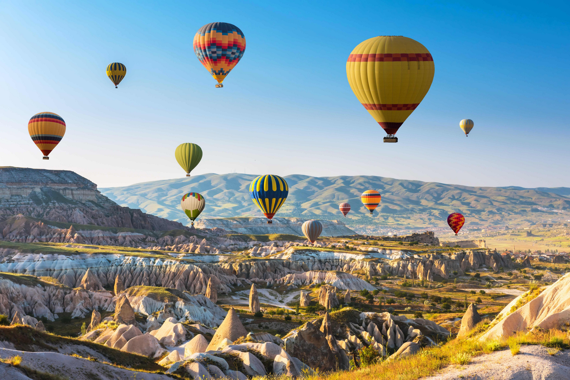 Things to do in Cappadocia: Hot air balloons floating above Cappadocia