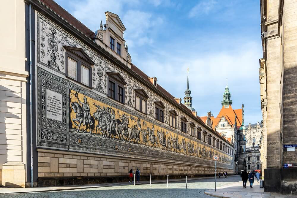 Procession of the Prices: A ceramic mosaic of men on horseback on a wall in Dresden