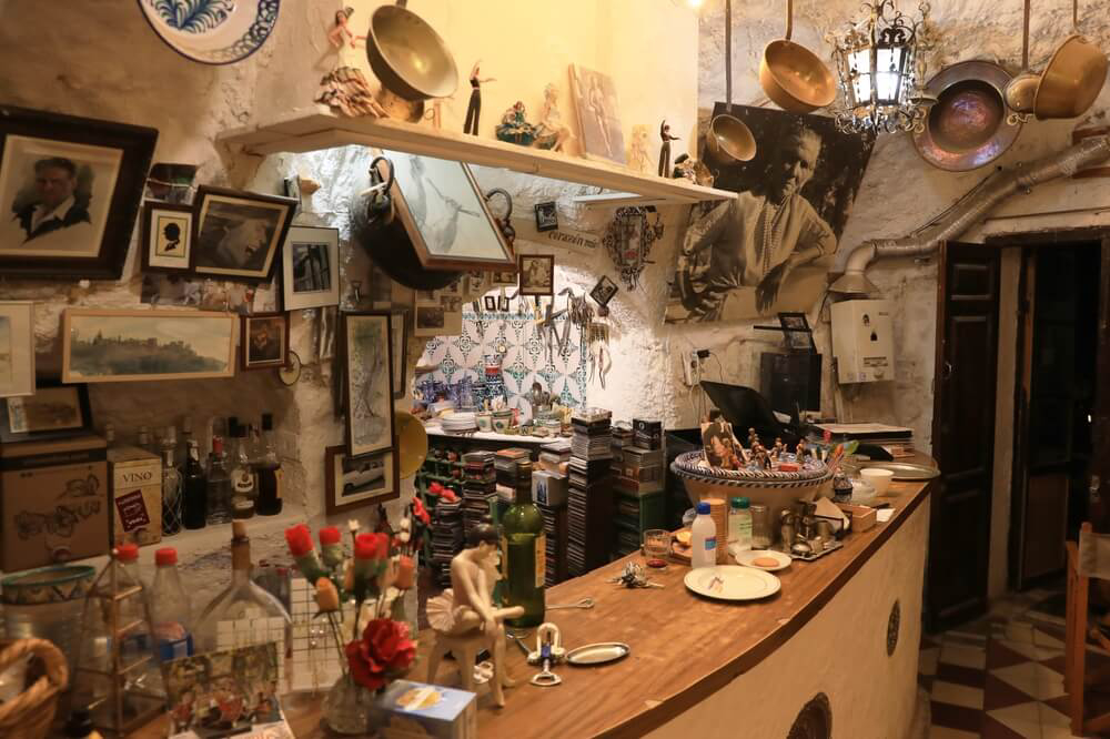 Sacromonte: Inside a cave home decorated with pictures and trinkets