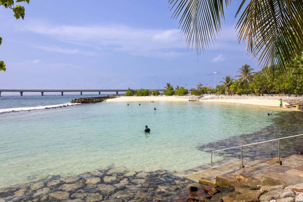 Things to do in Male: A white sand beach with stairs to the water