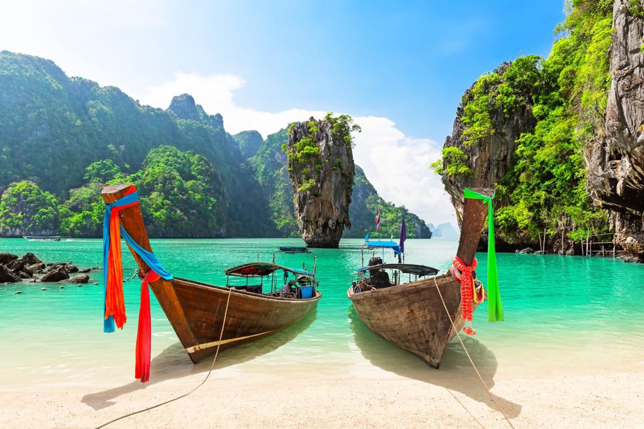 Things to see in Phuket: Two boats on the shore of the James Bond Island