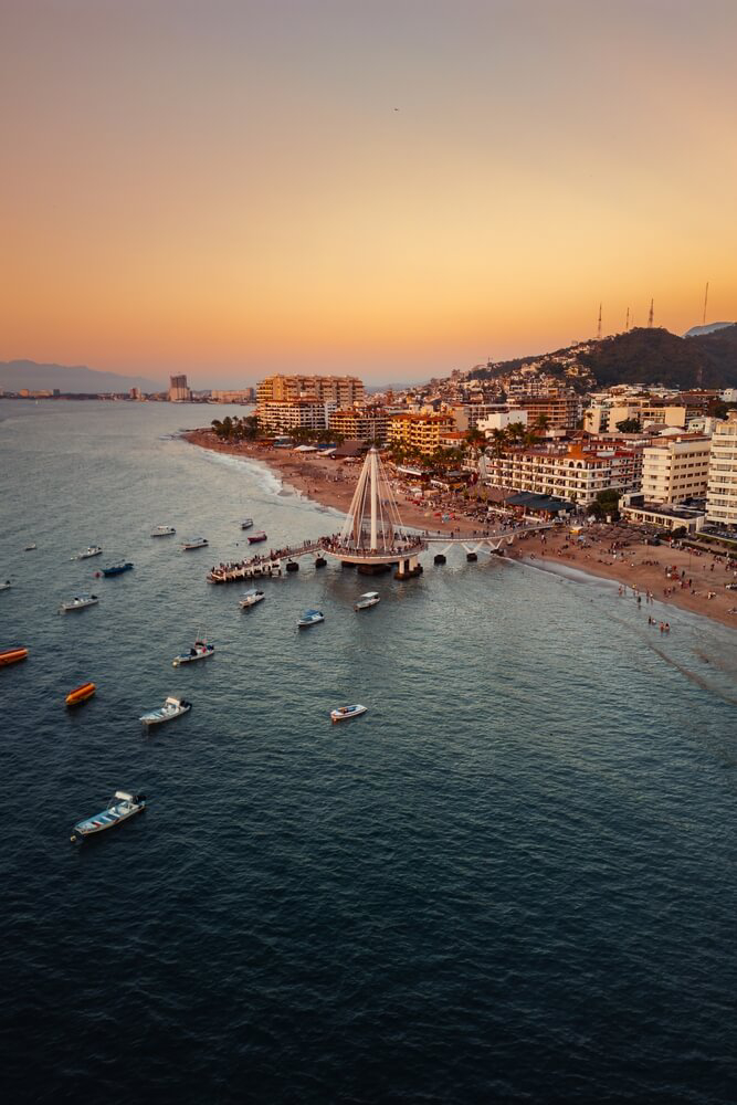 Things to do in Puerto Vallarta: Visit Playa De Los Muertos and go for a stroll on the pier.
