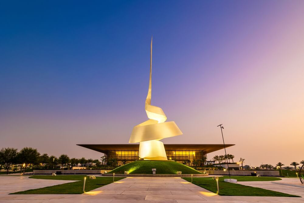 Things to do in Sharjah: A view of the twirling statue outside the Sharjah House of Wisdom