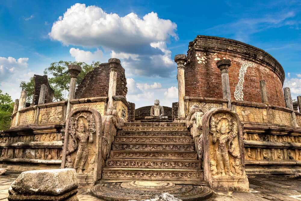 Polonnaruwa Ancient City: A close-up of the ancient carved stone ruins and Buddha statue