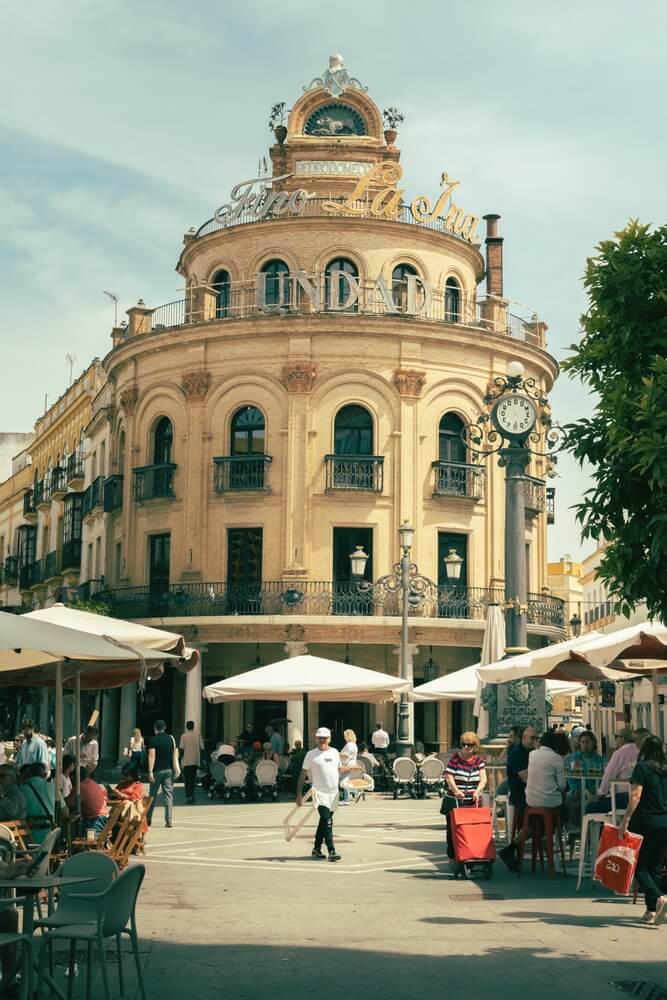 Calle Larga: A street view of a busy street in Jerez de la Frontera