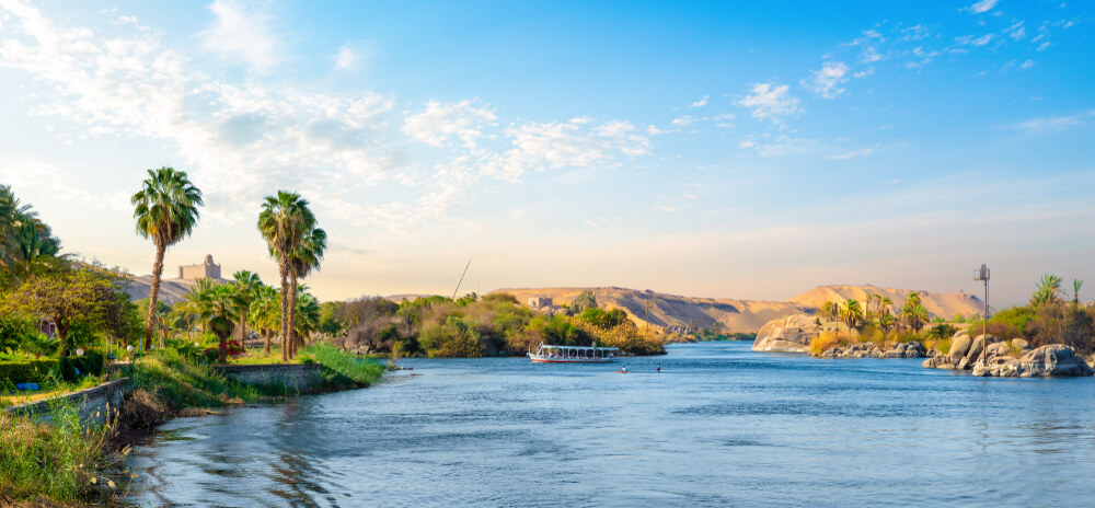 A wide-angle view of the River Nile and the green banks of the river