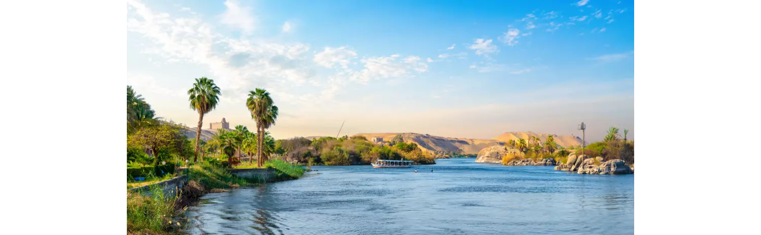A wide-angle view of the River Nile and the green banks of the river