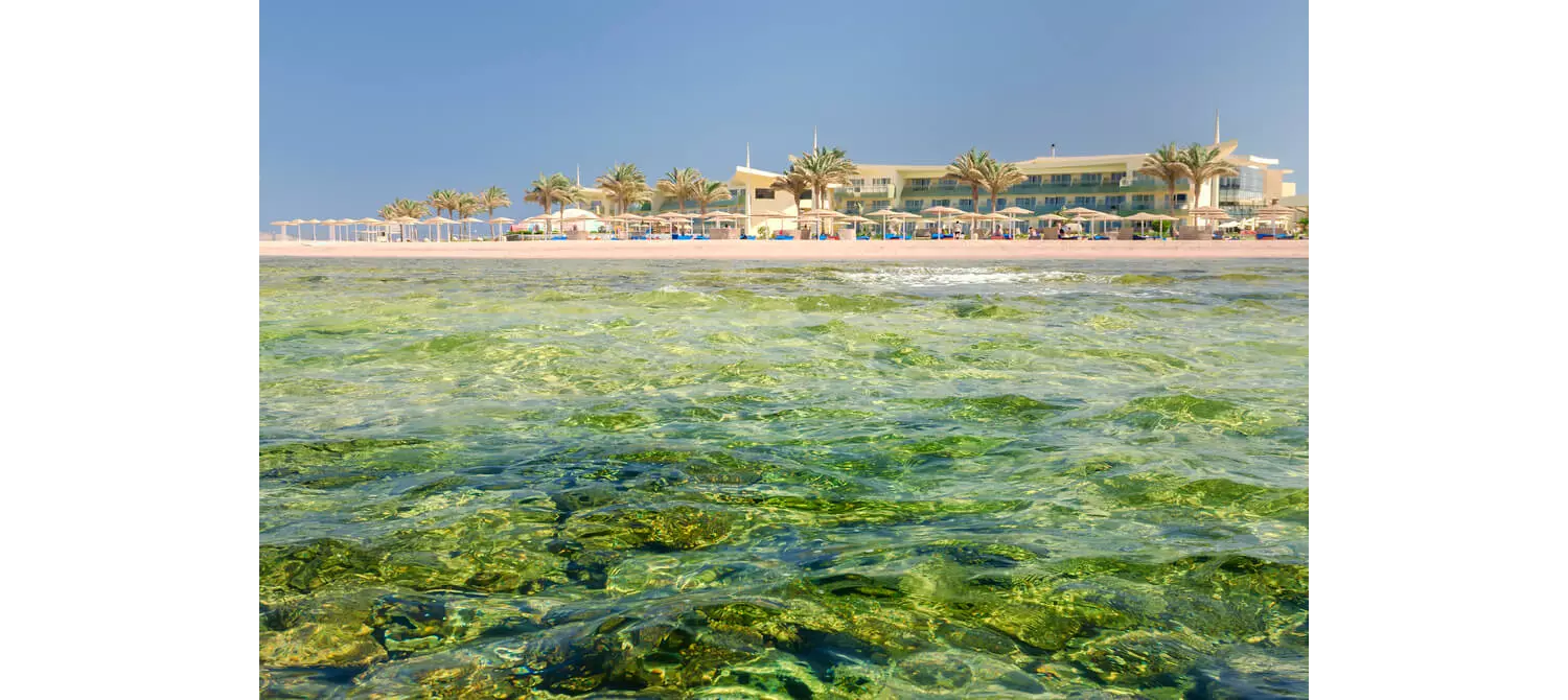 Famous places in Egypt: A view of the topaz waters and golden sand beach at Barceló Tiran Sharm